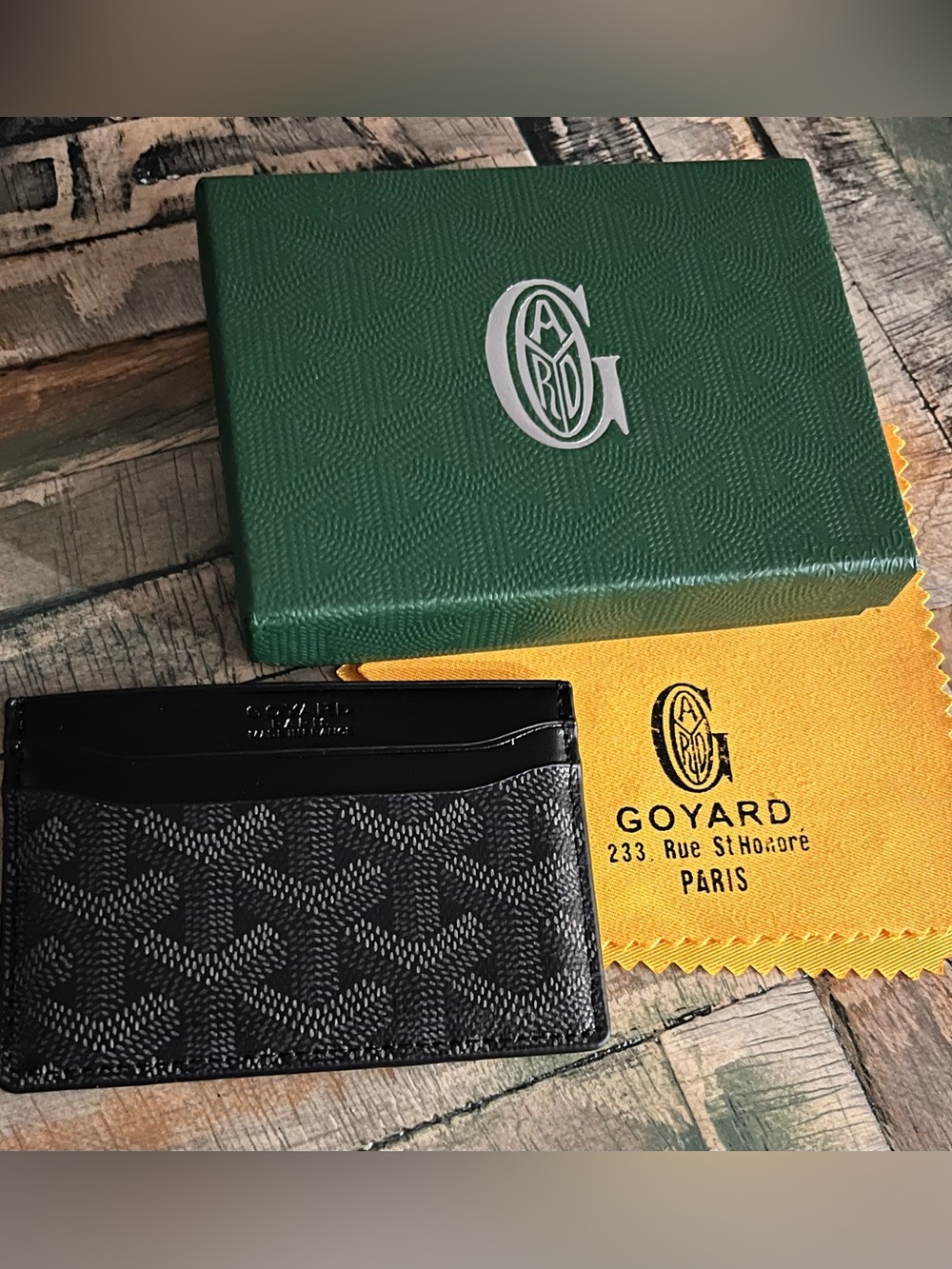 Goyard Black Chevron Card Case with Black Trim and a red sleek interior
